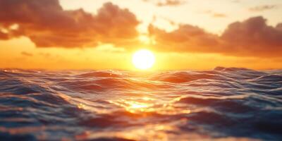 Golden sun setting over the ocean with gentle waves rolling photo