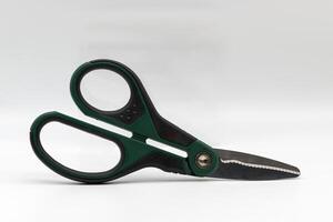 Multi purpose scissors isolated on white background. photo