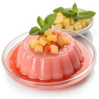 Guava-flavored pudding in a clear dish, bright pink hue, topped with pineapple bits and mint leaf, fruity and exotic, isolated photo