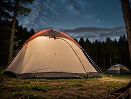 Beautiful Starry Night Camping with Illuminated Tents in Forest photo