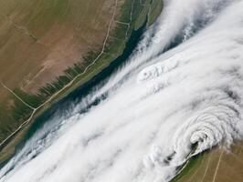 High-Altitude Shot of Fields, River, and Atmospheric Lines with clouds photo