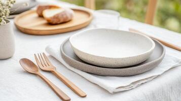 Admire a stunning table set with eco-friendly utensils and ceramic dishes for a green lifestyle, Earth Day concept photo