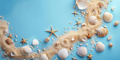 Seashells and sand on a blue background photo