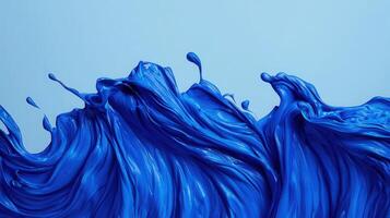 Swirling blue paint action abstract canvas art creation studio environment close-up view dreamy aesthetic photo
