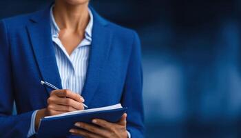 Focused female professional taking notes in office setting for business success photo