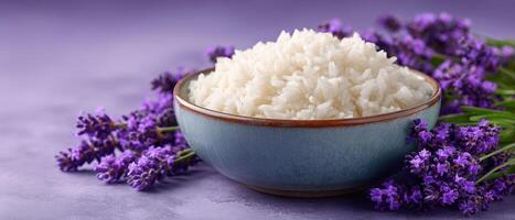 Freshly cooked rice in rustic bowl surrounded by lavender flowers food photography close-up photo