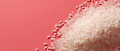 Minimalistic presentation of cooked rice scattered on coral background food photography close-up photo