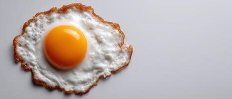 Crisp egg yolk on white surface clean food photography spa-like presentation photo