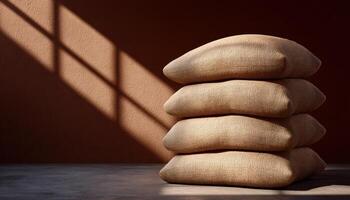 Grain bags stacked in sunlit warehouse industrial setting still life photography photo