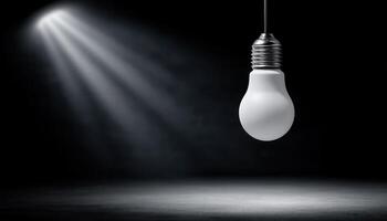 Illuminated bulb in spotlight dark surroundings artistic photography high contrast creative concept photo