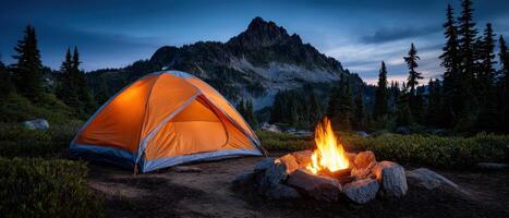 Early summer campfire and tents under starry sky mountain view nature adventure photo