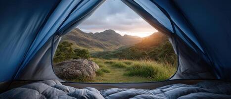 Captivating sunrise view from inside a tent overlooking mountain landscape photo