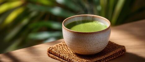 Steaming cup of matcha tea natural setting drink photography soft lighting tranquil concept photo