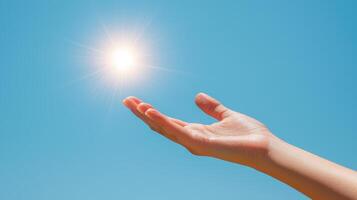 Reaching hand towards the sky nature photography bright sunflare inspirational concept photo