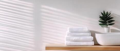 Minimalist bathroom scene with sunlight and soft towels bright and inviting atmosphere photo
