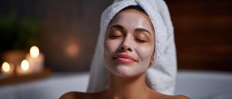 Woman applying nourishing face mask in spa closeup view relaxing skincare routine photo