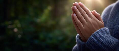 Peaceful hands in prayer pose nature close-up soft natural light serenity concept photo