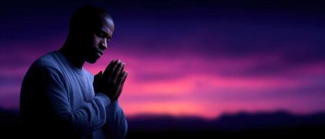 Person praying silhouette at sunrise open sky inspirational photography serene environment photo
