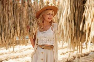 Bunch, of dried plants. Beautiful woman, is in the greenhouse photo