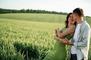 Non ,urban scene. Lovely couple are on the agricultural field together photo