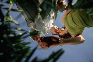 View, from below of couple that is standing in the agricultural field photo