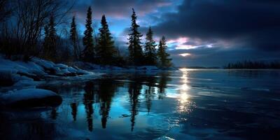 Twilight reflections over a serene lake with evergreen trees under a cloudy sky photo
