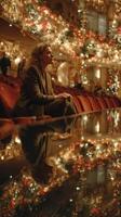 Woman sitting in a theater during a festive event with holiday decorations and soft lighting in the background photo