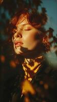 Sunlit woman with curly hair surrounded by autumn leaves in a tranquil outdoor setting during golden hour photo