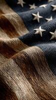 American flag design with textured fabric showcasing detailed stars and stripes in warm tones and natural colors photo