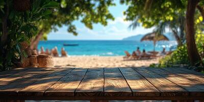 Relaxing beachfront view with a rustic wooden table under the shade on a sunny day near clear water photo