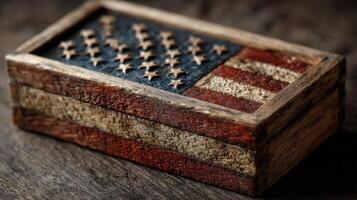 Wooden box featuring a carved American flag design on a rustic wooden surface photo