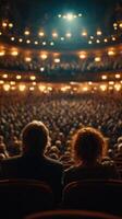 Evening performance at a grand theater with an audience captivated by the show photo