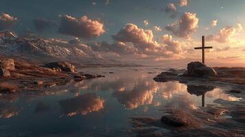 Reflective sunset over serene waters with a cross standing in a rocky landscape photo