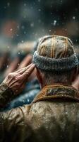 Saluting under the rain during a ceremonial event in an outdoor setting with soldiers in a background photo