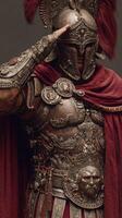 Warrior in elaborate armor saluting during a ceremonial event in an ancient setting illuminated by soft light photo