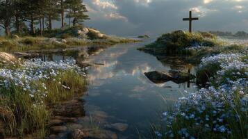Serene landscape with a cross beside a calm waterway surrounded by wildflowers at dusk photo