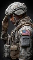 Soldier saluting during a ceremonial tribute at an undisclosed military base in the early morning hours photo