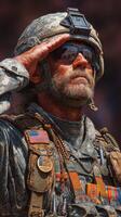 Soldier saluting during ceremonial event with medals and fatigues in bright sunlight photo