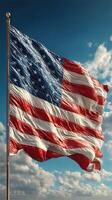 Waving American flag against a cloudy sky during the day photo