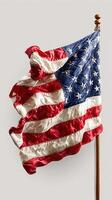 American flag waving on a wooden pole against a light background showcasing vibrant colors and intricate details photo