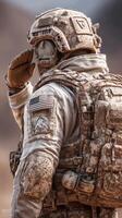 Military personnel saluting with an American flag patch during a training exercise in a dusty desert landscape photo