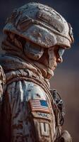 Soldier in dusty camouflage gear standing confidently during a military operation in rugged terrain with a serious expression photo