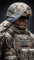 Soldier in camouflage uniform salutes with icy details during winter conditions photo