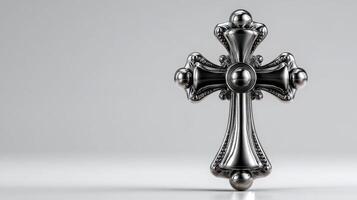 Ornate black metal cross displayed on a bright background capturing intricate details and elegant design photo