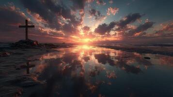 Spectacular sunset over a calm sea with a cross silhouette on the shore photo
