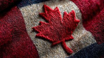 Rich red maple leaf embroidery on fabric showcasing Canadian heritage and pride photo