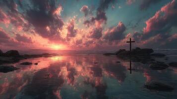Sunset reflection at a serene coast with a cross standing beside the tranquil water photo