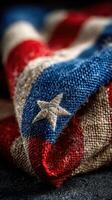 Folded fabric showcasing red, white, and blue colors with a star pattern during a patriotic celebration or event photo
