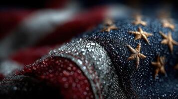 Detailed view of an American flag with droplets highlighting its textures and colors during a calm morning light photo