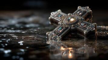 Jewelry piece with intricate design reflecting light on a dark surface during a quiet moment of contemplation photo